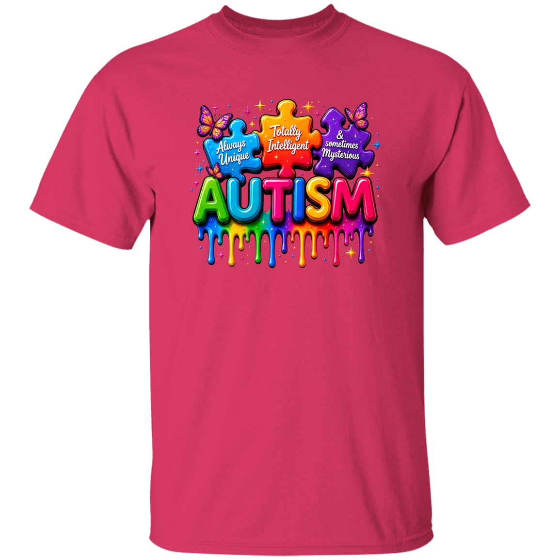 A bright pink short-sleeve crewneck t-shirt featuring a colorful graphic on the chest with puzzle pieces, butterflies, and the word 'AUTISM' in dripping rainbow letters.