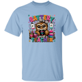 A light blue short-sleeve crewneck t-shirt featuring a colorful graphic of an owl wearing a leopard-print hat, surrounded by school supplies and the text 'BATTERY LIFE OF A TEACHER'.
