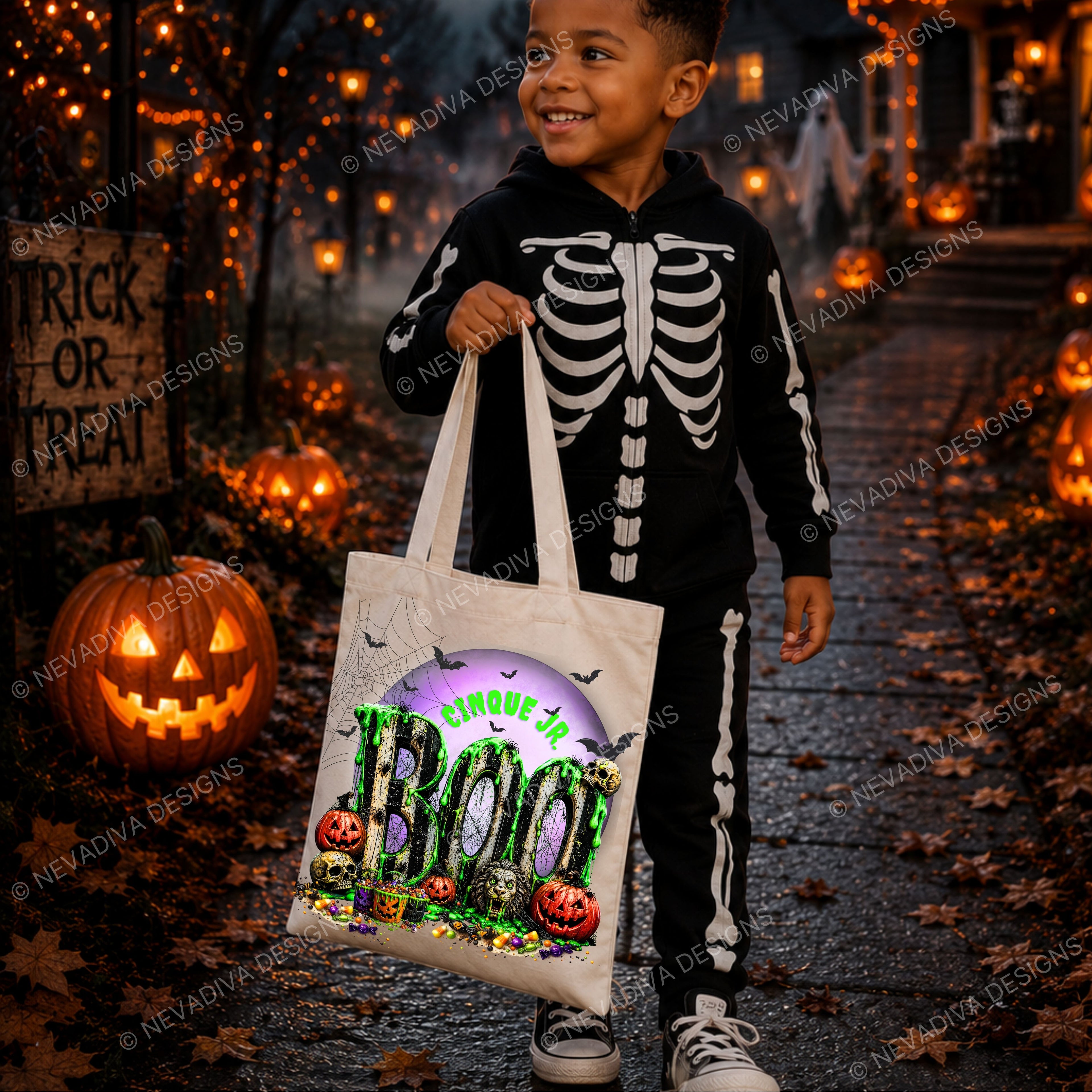 A young boy wearing a black and white skeleton Halloween costume stands on a leaf-covered path at night, holding a white tote bag with a colorful 'BOO' graphic. The background features glowing jack-o'-lanterns, string lights, and a 'Trick or Treat' sign.