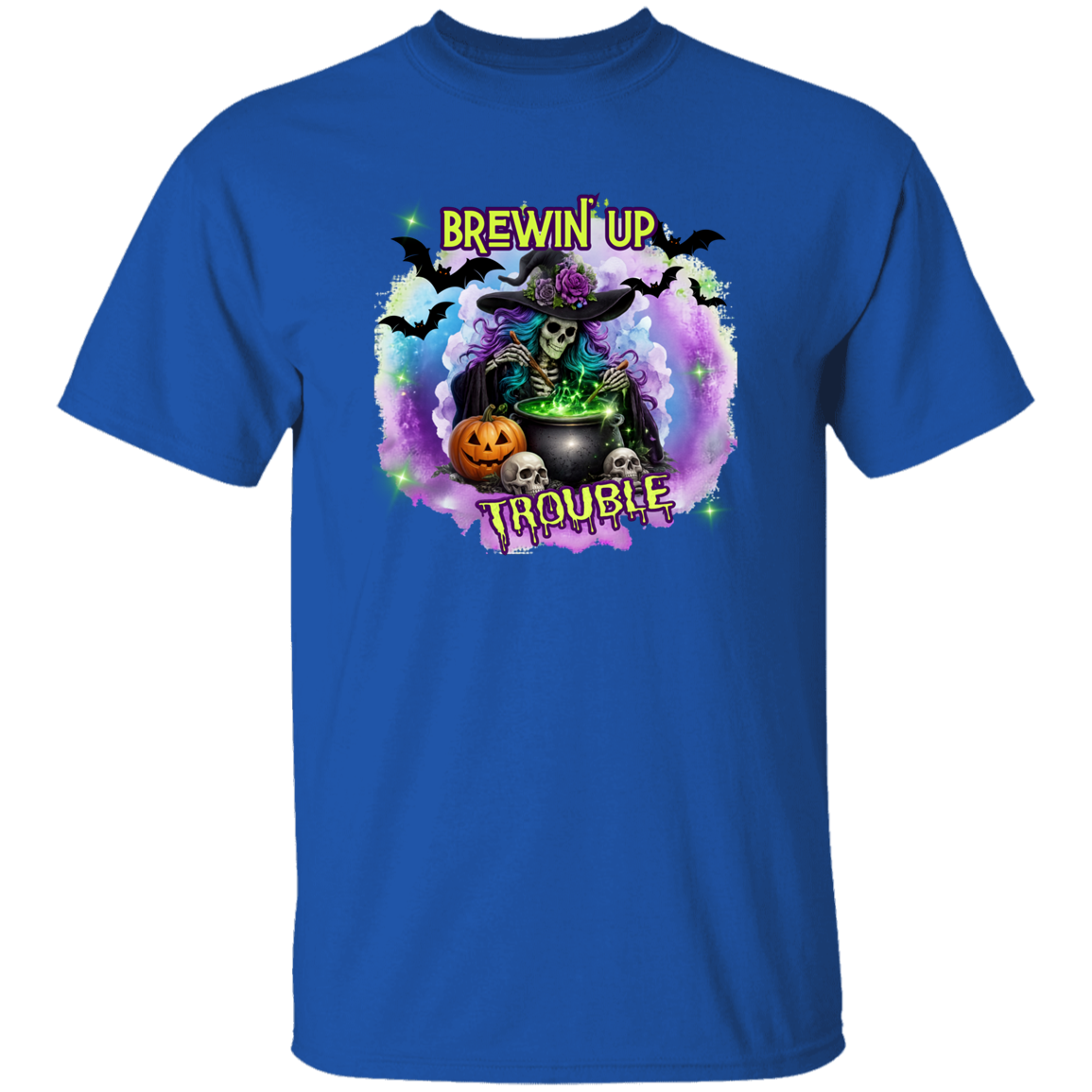 A royal blue short-sleeve crewneck t-shirt featuring a colorful Halloween graphic on the chest. The graphic depicts a skeleton witch wearing a witch hat and sitting behind a cauldron with green potion, surrounded by bats, a jack-o'-lantern, skulls, and the text 'BREWIN' UP TROUBLE' in a yellow font.