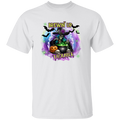A white short-sleeve crewneck t-shirt featuring a colorful Halloween graphic on the chest. The graphic depicts a skeleton witch wearing a purple rose-studded hat and sitting by a cauldron with the text 'BREWIN' UP TROUBLE' in yellow.