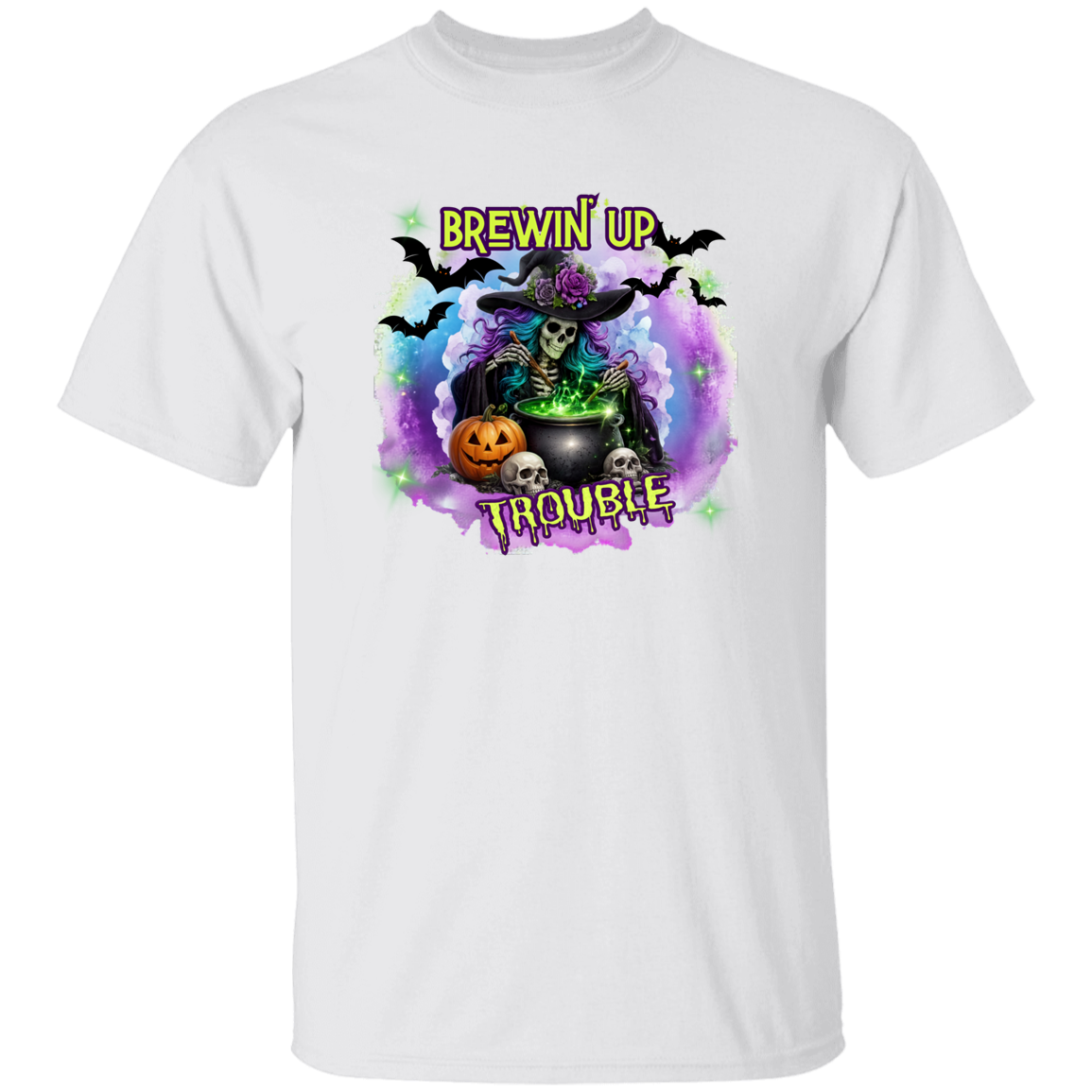 A white short-sleeve crewneck t-shirt featuring a colorful Halloween graphic on the chest. The graphic depicts a skeleton witch wearing a purple rose-studded hat and sitting by a cauldron with the text 'BREWIN' UP TROUBLE' in yellow.