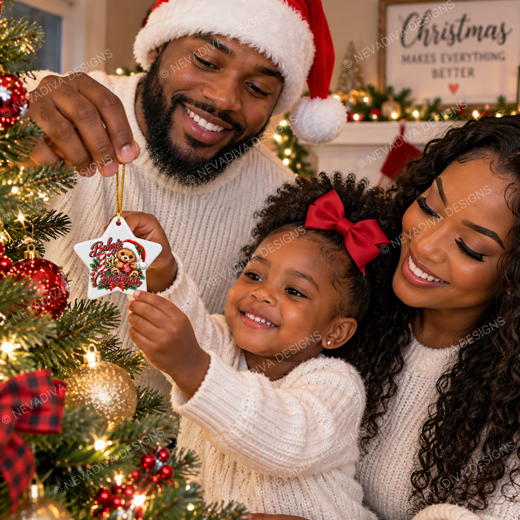 A family of three celebrates Christmas indoors, with a father and daughter hanging a white star ornament decorated with a cartoon Santa on a decorated Christmas tree. The mother, father, and daughter are all wearing matching cream knit sweaters.