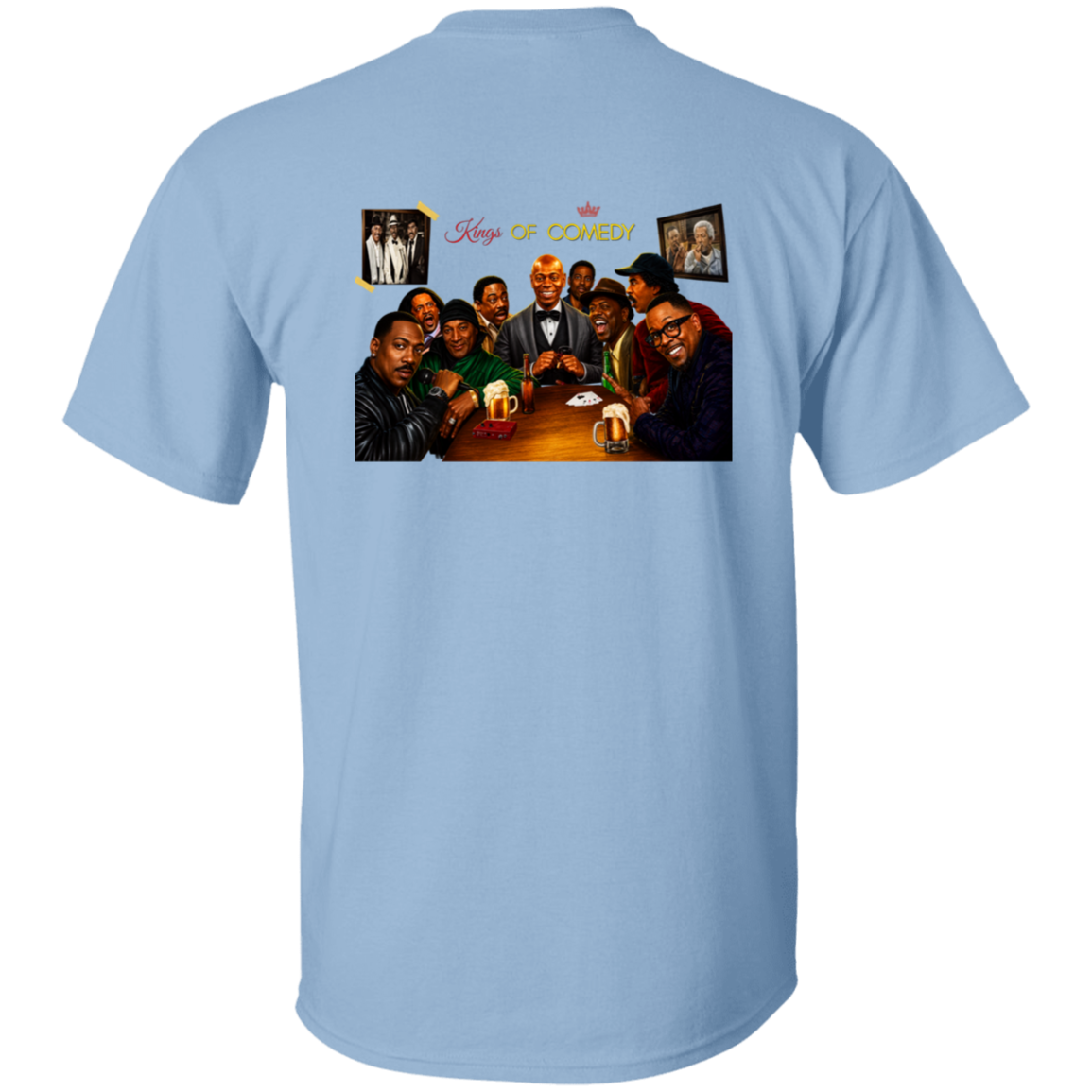 A light blue short-sleeve t-shirt shown from the back, featuring a large graphic print of the 'King's of Comedy' cast sitting around a table with the text 'King's OF COMEDY' above them.