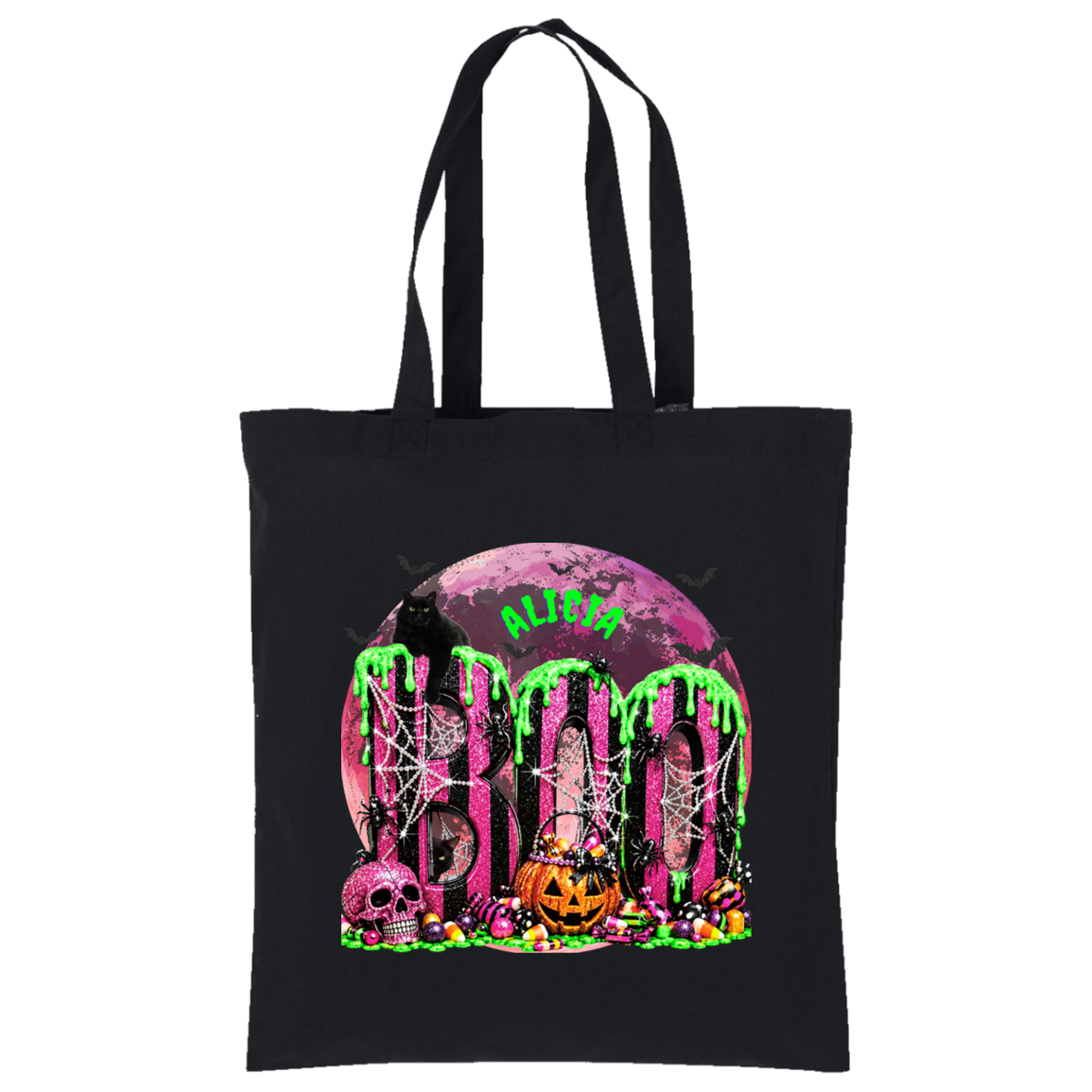 A black canvas tote bag with a vibrant Halloween graphic featuring the word 'BOO' in dripping neon green letters over a pink moon, spiderwebs, skulls, and candy, with the word 'ALIVE' in green above.