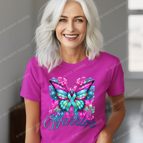 Woman wearing a pink t-shirt with a colorful butterfly design and the word 'Warrior'.