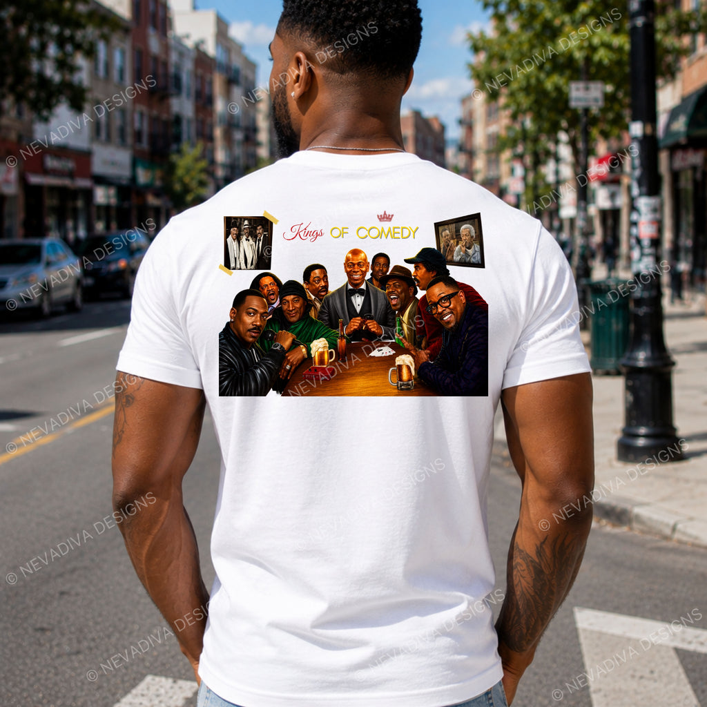 A man viewed from behind wearing a white t-shirt with a large graphic print on the back. The graphic features a group photo of comedians with the text 'Kings of Comedy' and two small portrait frames.