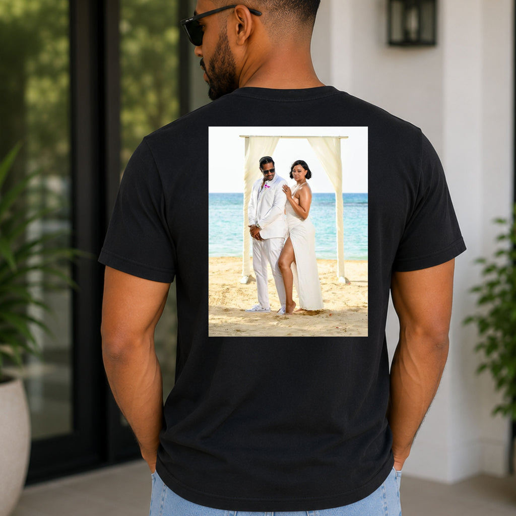 A man wearing a custom photo t shirt showing the back of his black shirt with a wedding photo on it