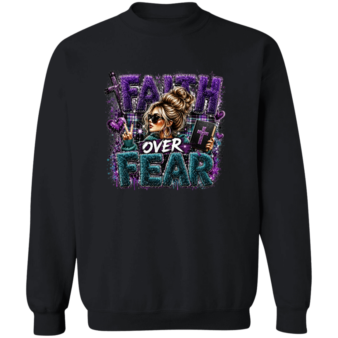 A black crewneck sweatshirt featuring a large graphic print on the front with the text 'FAITH OVER FEAR' in purple and teal glitter-style lettering, alongside an illustration of a woman in sunglasses.