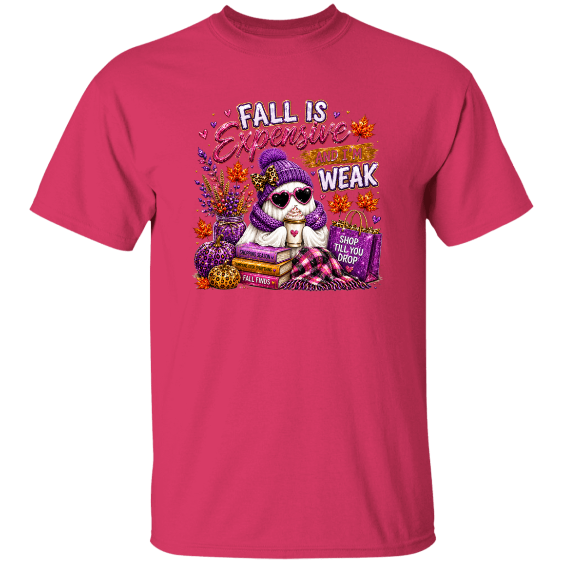 A bright pink short-sleeve crewneck t-shirt featuring a colorful graphic of a ghost wearing a purple knit hat and sunglasses, surrounded by fall elements and the text 'FALL IS Expensive AND WEAK'.