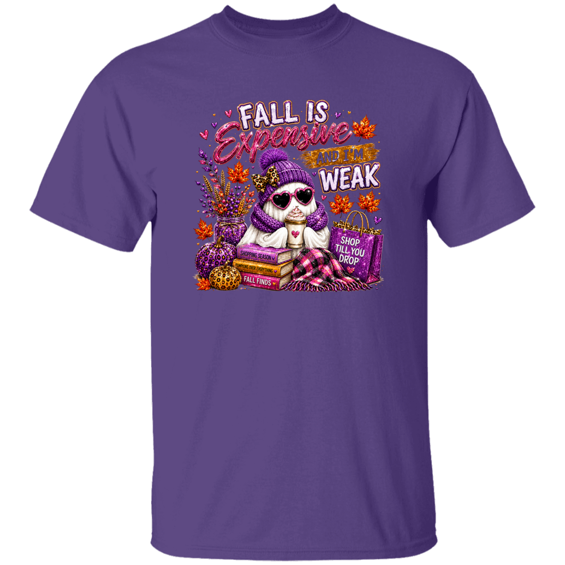 A purple short-sleeve crewneck t-shirt featuring a colorful graphic print of a ghost wearing a purple knit hat and scarf, sitting on books with autumn-themed text that reads 'FALL IS Expensive AND WEAK'.