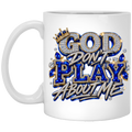 A white ceramic mug featuring a bold graphic design with the text 'GOD DON'T PLAY ABOUT ME' styled in metallic silver, royal blue, and gold with rhinestone-like embellishments.