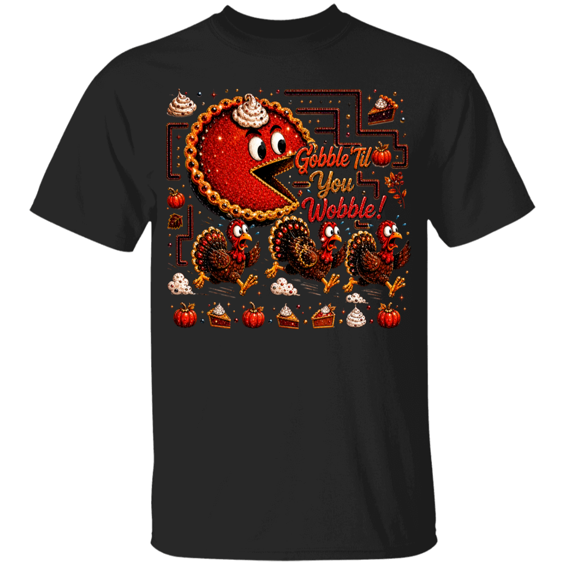 A black short-sleeve crewneck t-shirt featuring a colorful Thanksgiving-themed graphic print on the front. The graphic includes a red and yellow pie character with whipped cream, three turkeys, slices of pie, pumpkins, and the text 'Gobble Till You Wobble!'.
