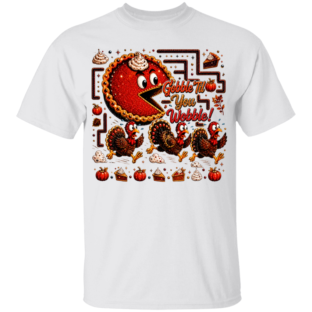 A white short-sleeve crewneck t-shirt featuring a colorful Thanksgiving-themed graphic print on the front. The graphic shows a cartoon pie eating a maze with the text 'Gobble T-You Webble!' and illustrations of turkeys, pumpkins, and pie slices.