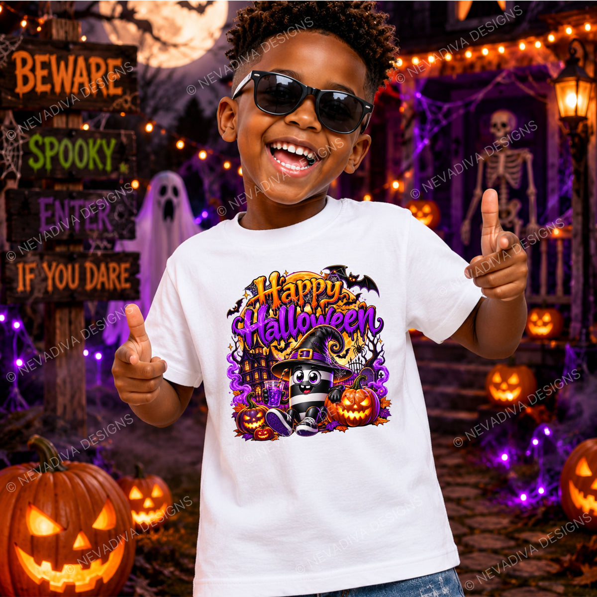 A young boy wearing black sunglasses and a white graphic t-shirt with a colorful 'Happy Halloween' design, posing in a spooky Halloween-themed room with pumpkins, a skeleton, and string lights.