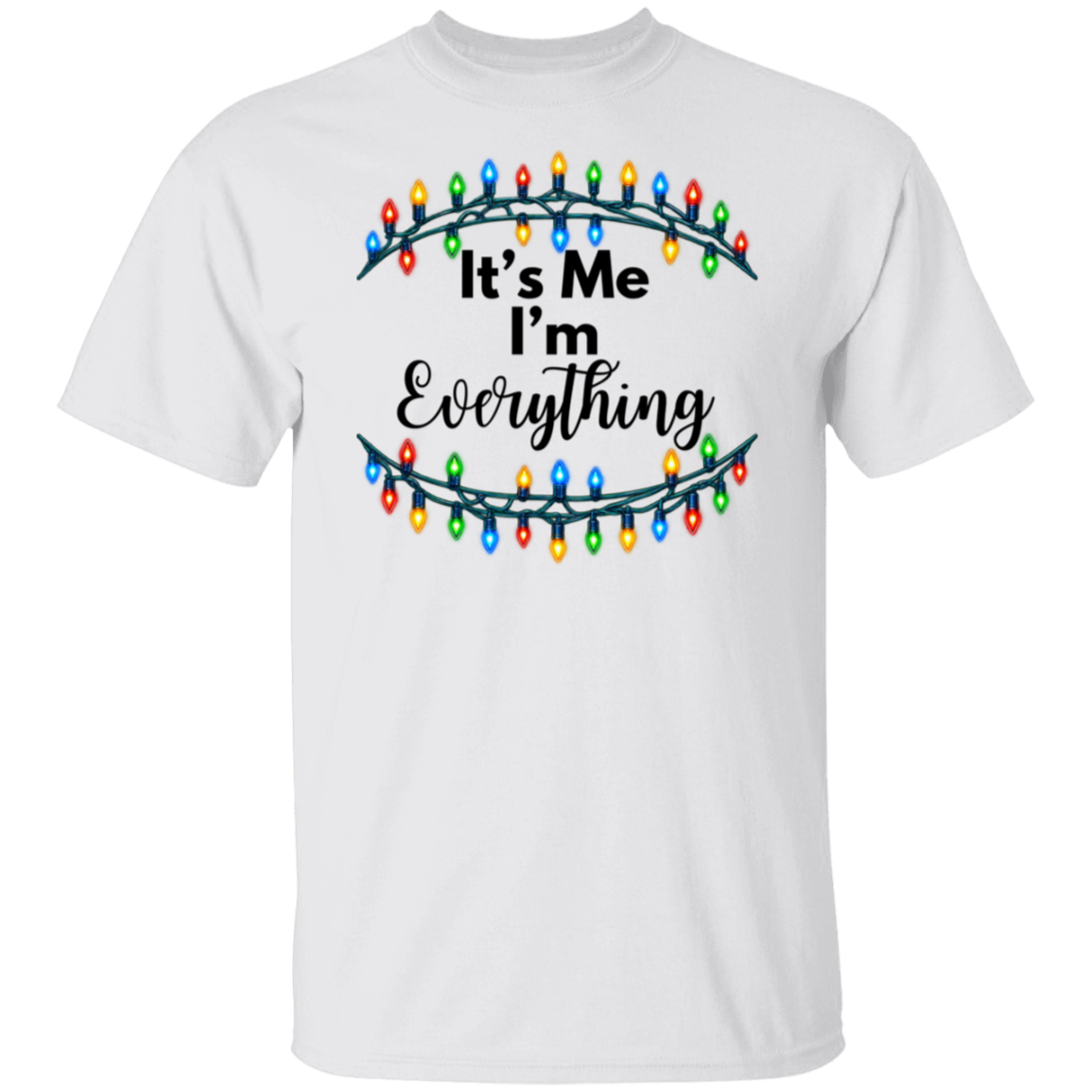 A white short-sleeve crewneck t-shirt featuring a graphic design of Christmas string lights framing the text 'It's Me I'm Everything' in black lettering.