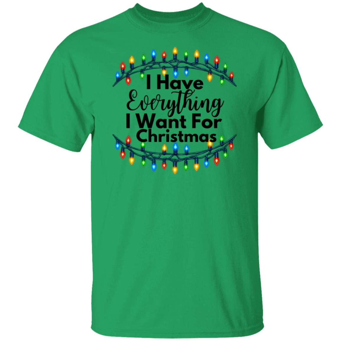 A bright green short-sleeve crewneck t-shirt featuring a graphic print of a Christmas tree light string with colorful bulbs and the text 'I Have Everything I Want For Christmas' in black lettering.