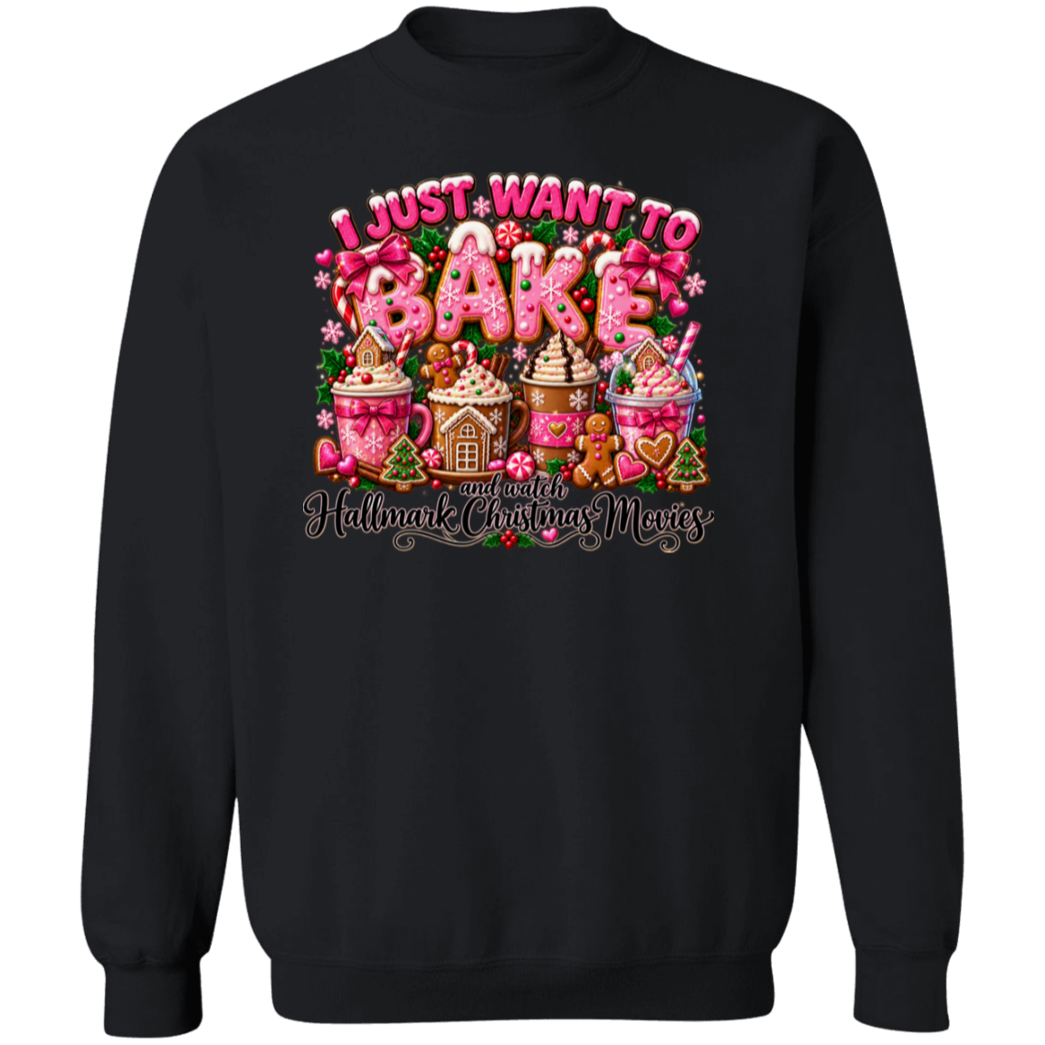 A black crewneck sweatshirt featuring a large, colorful graphic on the front. The graphic displays the text 'I JUST WANT TO BAKE' in pink and white icing-style lettering above a festive collection of gingerbread houses, gingerbread men, hot cocoa cups, and cookies decorated with pink and white icing, topped with the phrase 'AND WATCH Hallmark Christmas MOVIES'.