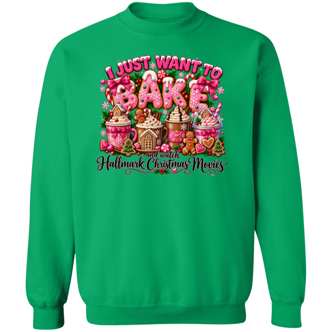 A bright green crewneck sweatshirt featuring a colorful graphic print on the front. The graphic displays the text 'I JUST WANT TO BAKE and watch Hallmark Christmas Movies' in pink and white lettering, accompanied by festive illustrations of gingerbread houses, hot cocoa cups, and gingerbread people.