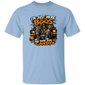 A light blue short-sleeve crewneck t-shirt featuring a Halloween graphic of a skeleton in a casket on a car with jack-o'-lanterns. The text reads 'I'M JUST HERE FOR THE BOOS AND MAYBE SOME CANDY'.