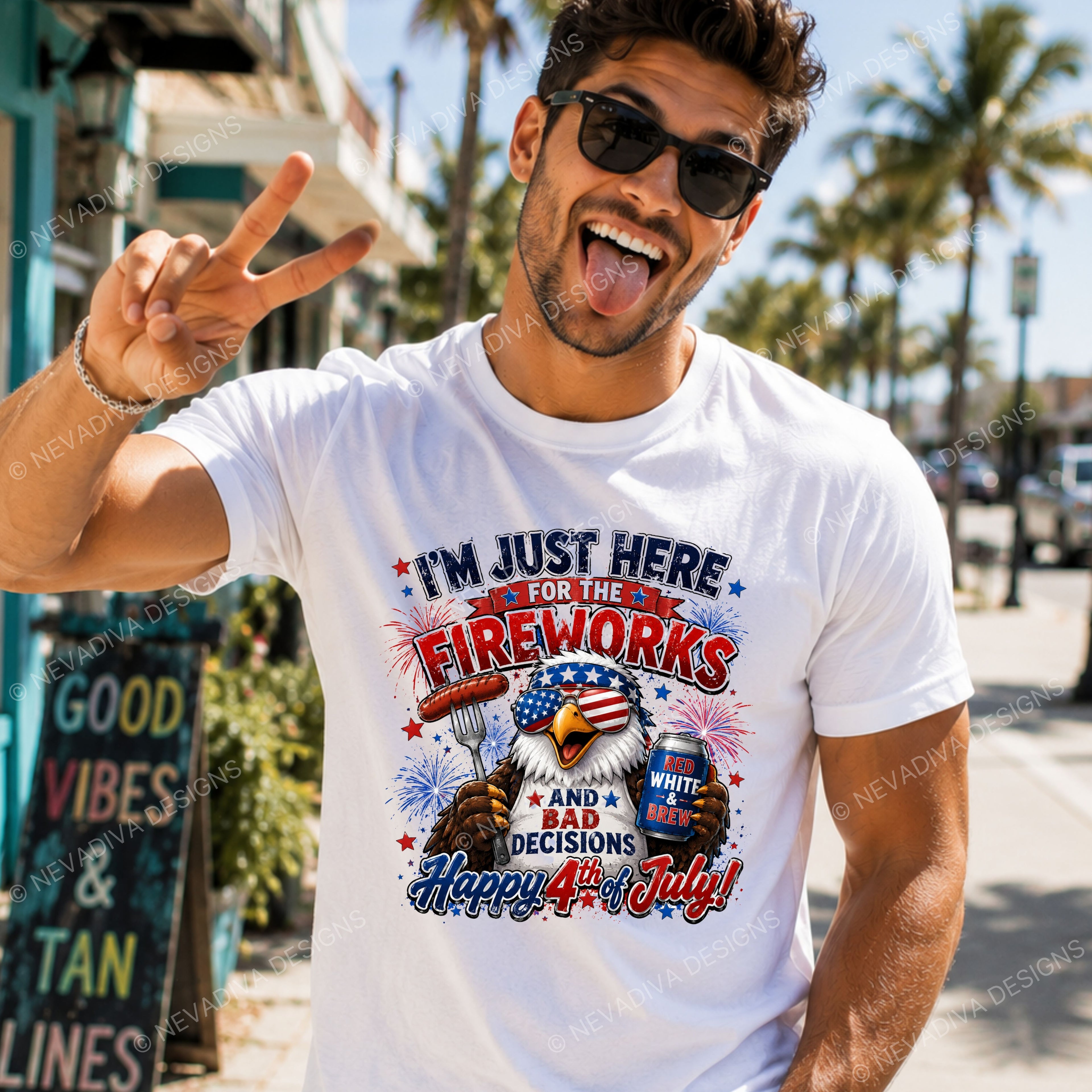 Man wearing a white t-shirt with 4th of July design, making a peace sign outdoors.