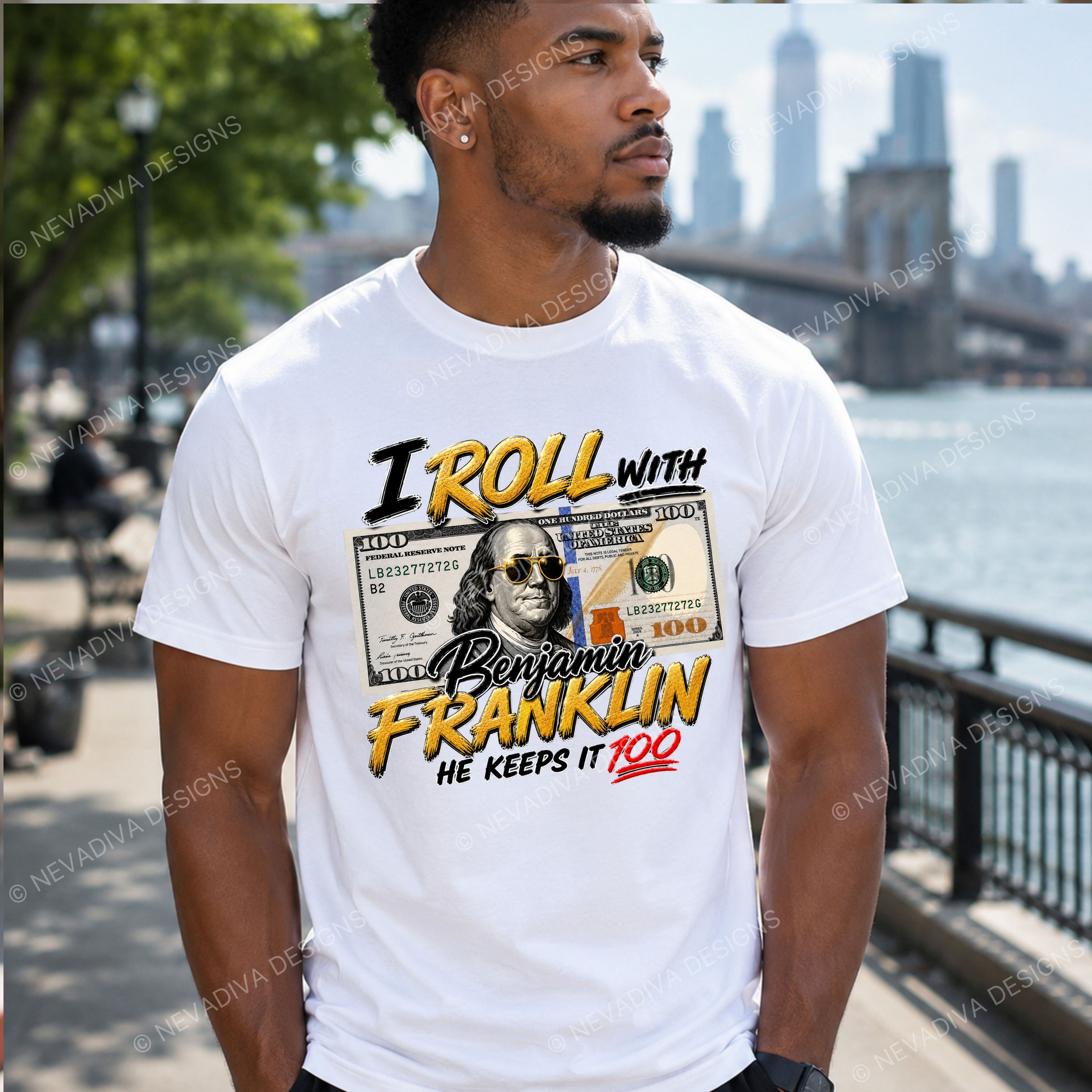 man wearing t-shirt with text I roll with Benjamin Franklin, he keeps it 100 with an outdoor background.