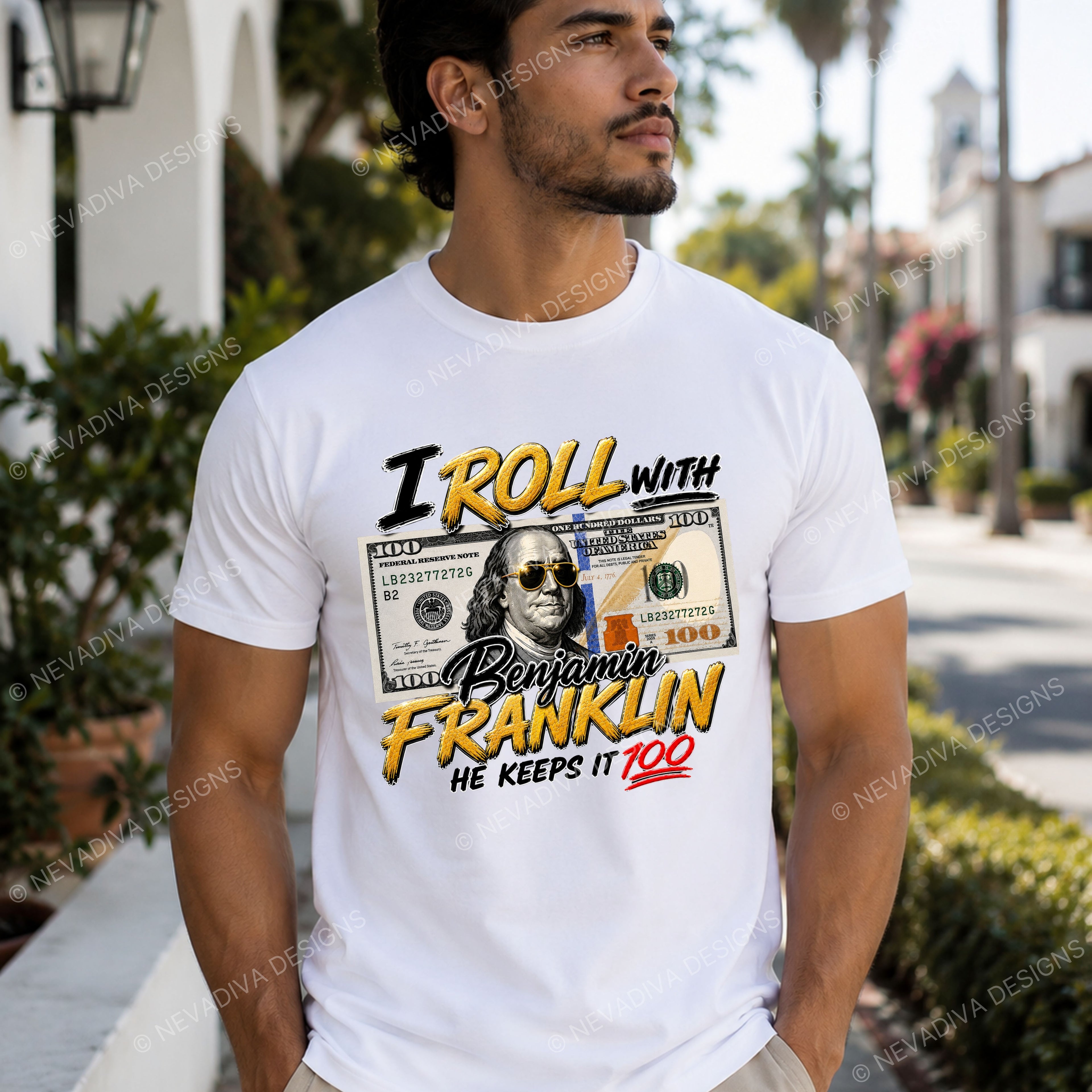 man wearing t-shirt with text I roll with Benjamin Franklin, he keeps it 100 with an outdoor background.