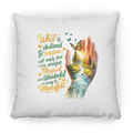 Decorative pillow with a hand holding a butterfly design and motivational quote on a white background
