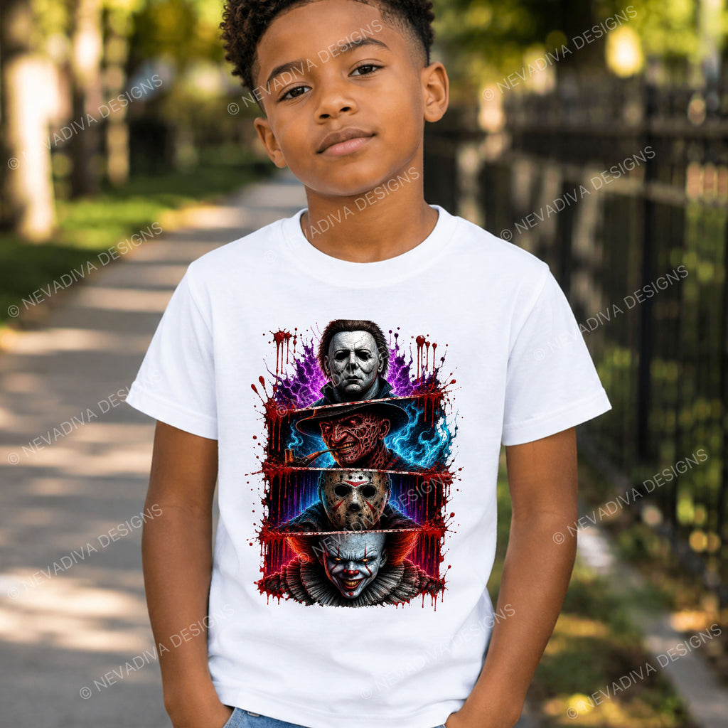 A young boy wearing a white graphic t-shirt featuring horror movie character prints of Michael Myers, Jason Voorhees, Freddy Krueger, and Pennywise, set against a blurred outdoor background.