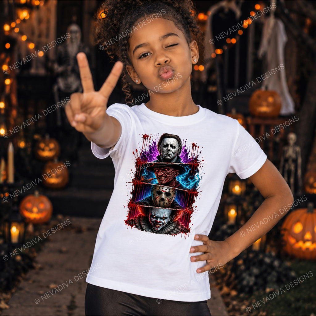 A child wearing a white graphic T-shirt with a colorful horror character print, posing in a Halloween-decorated outdoor setting with pumpkins and lights.