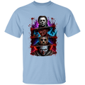 A light blue crewneck t-shirt featuring a large, colorful graphic print of three horror movie villains (Michael Myers, Jason Voorhees, and Pennywise the Clown) stacked vertically with a bloody chainsaw motif and paint splatters.
