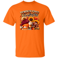 Orange t-shirt with 'Pumpkin Spice & Everything Nice' graphic design on a white background