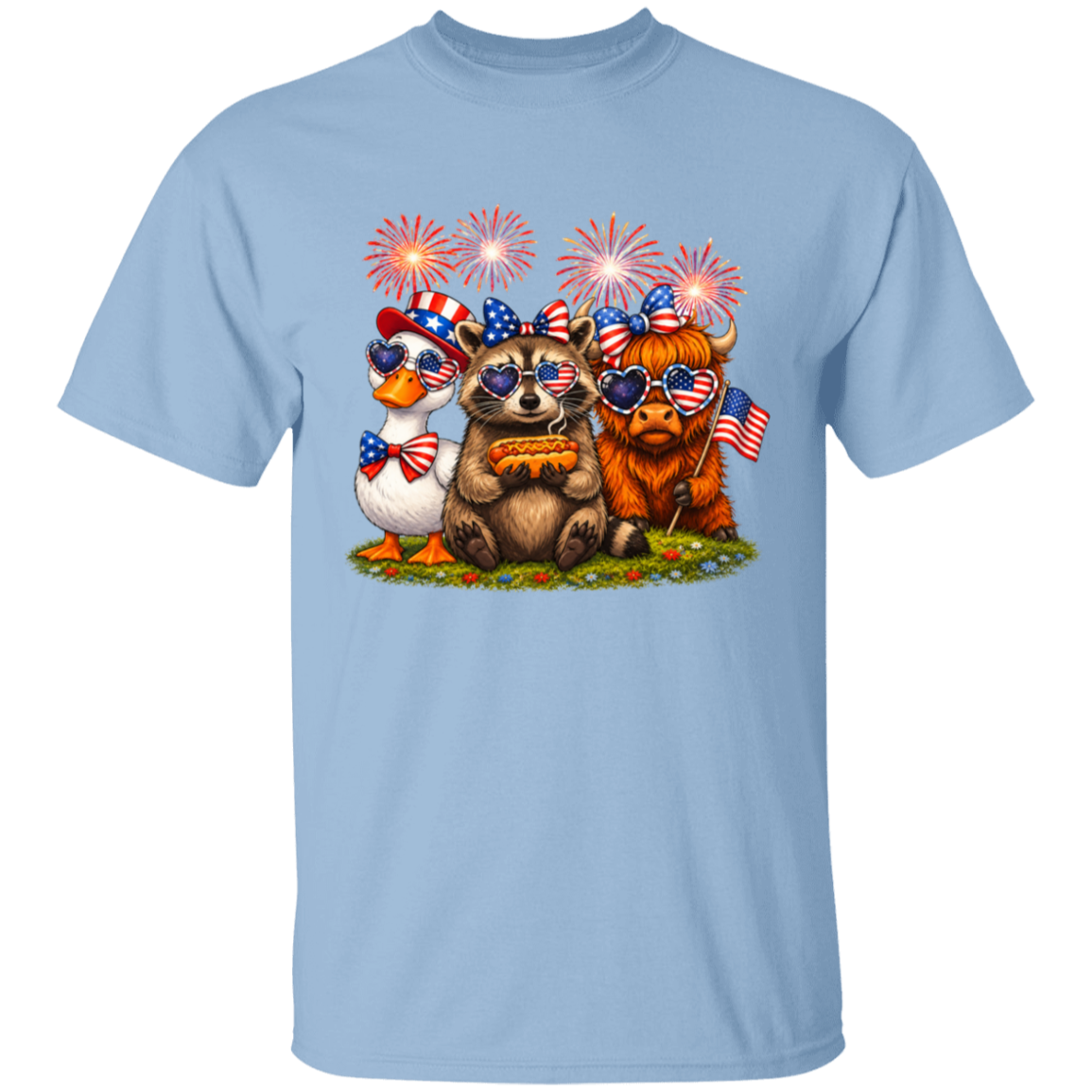 Light blue t-shirt with a design of bears, a duck, and a pumpkin with American flags and fireworks on a white background.