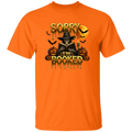 A man wearing a T-shirt with a text SORRY I'M BOOKED with a scary man next to pumpkins and bats flying