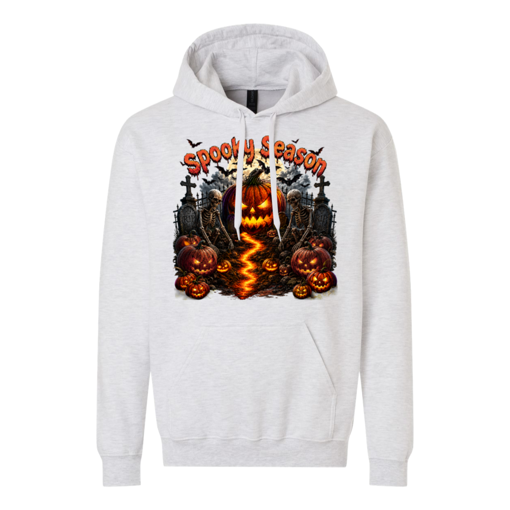 A light heather gray pullover hoodie featuring a large, colorful Halloween graphic on the chest with jack-o'-lanterns, tombstones, bats, and the text 'Spooky Season'.