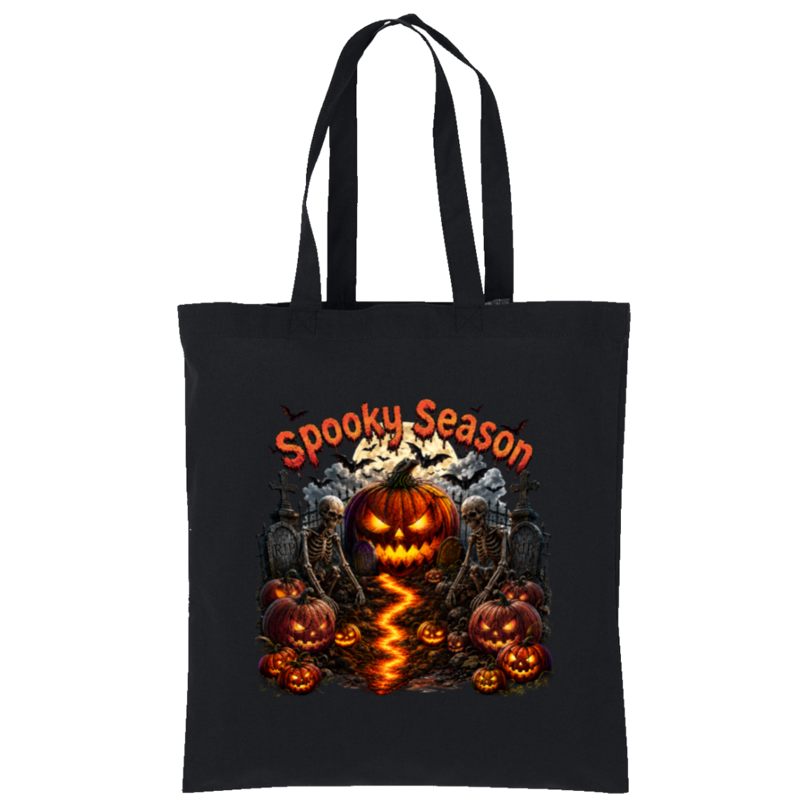 A black canvas tote bag with long black handles, featuring a Halloween graphic print on the front. The design includes the text 'Spooky Season' in orange, a glowing jack-o'-lantern pumpkin, smaller pumpkins, tombstones, bats, and a winding orange flame-like path.