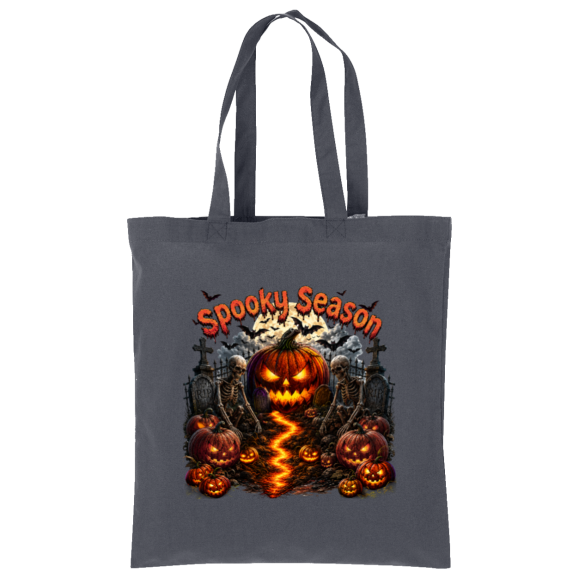A dark gray tote bag with a Halloween graphic print featuring a glowing jack-o'-lantern, smaller pumpkins, skeletons, tombstones, bats, and the text 'Spooky Season' in orange, shown on a plain white background.
