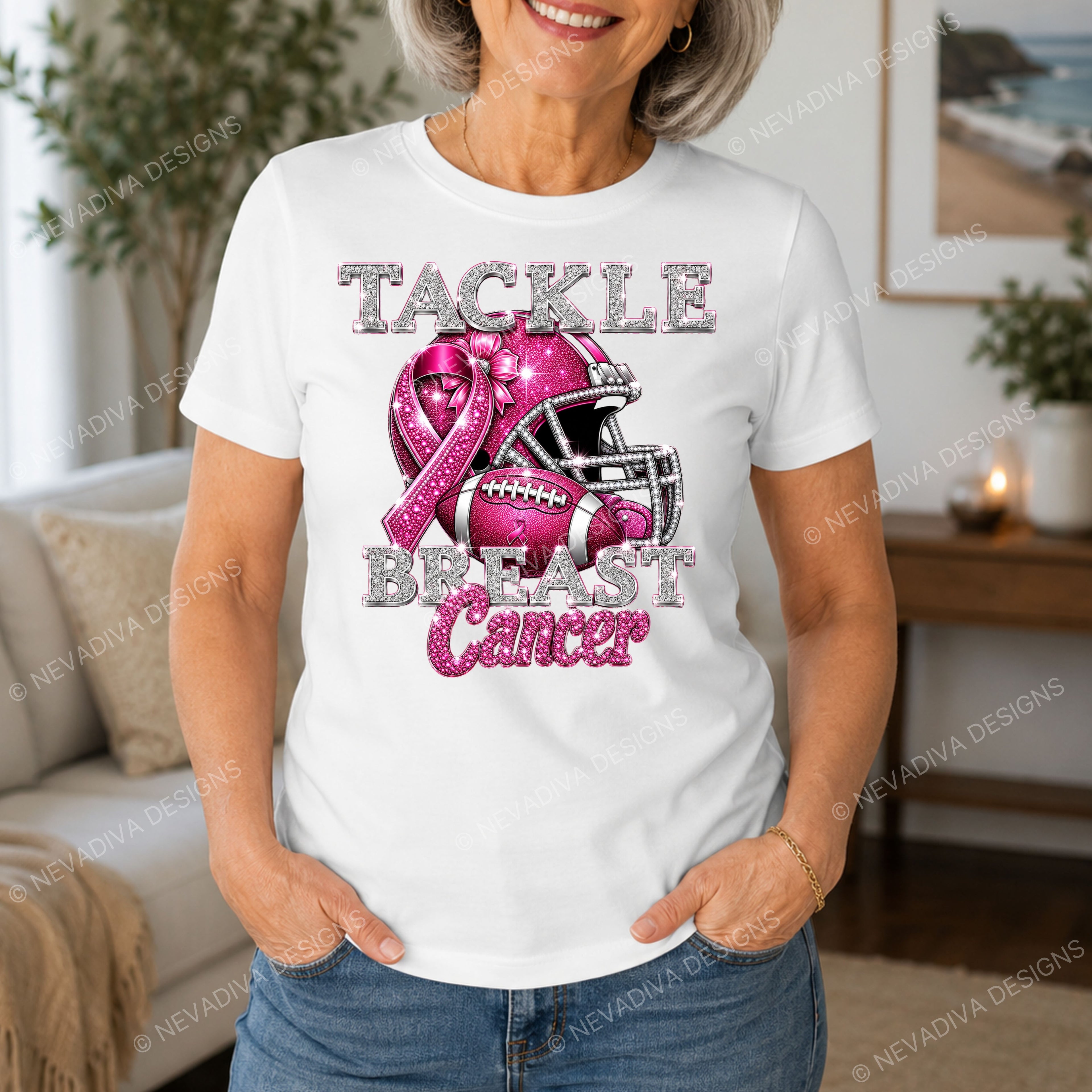 Woman wearing a white t-shirt with pink breast cancer awareness design in a living room.