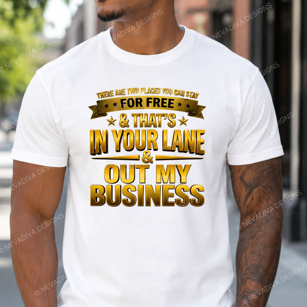 Person wearing a white t-shirt with gold text in an urban setting