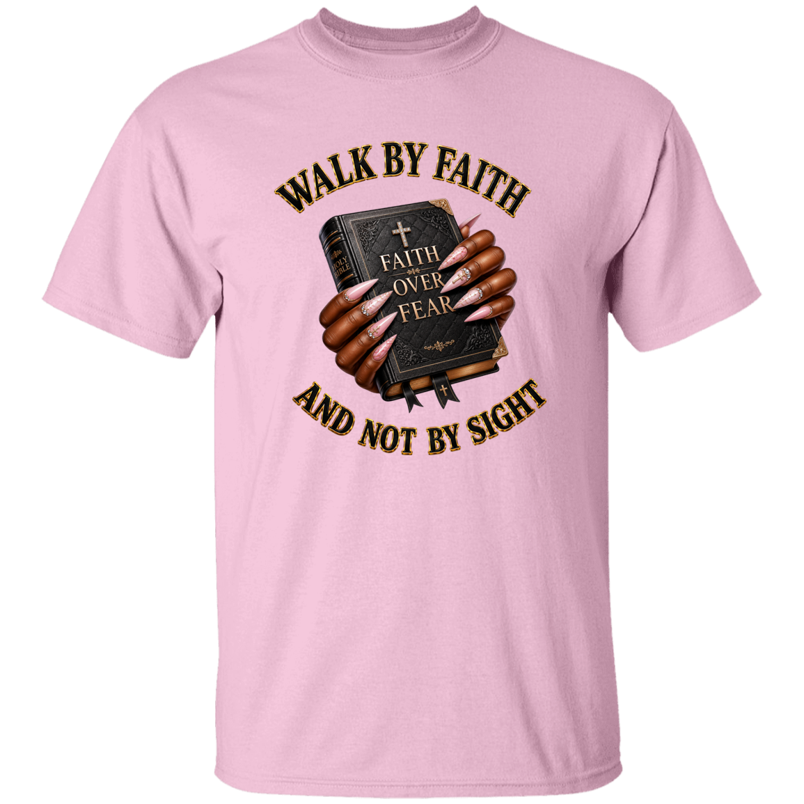 A light pink short-sleeve crewneck t-shirt featuring a graphic of a hand holding a Bible with the text 'FAITH OVER FEAR' and the phrases 'WALK BY FAITH' and 'AND NOT BY SIGHT' in arched black lettering.
