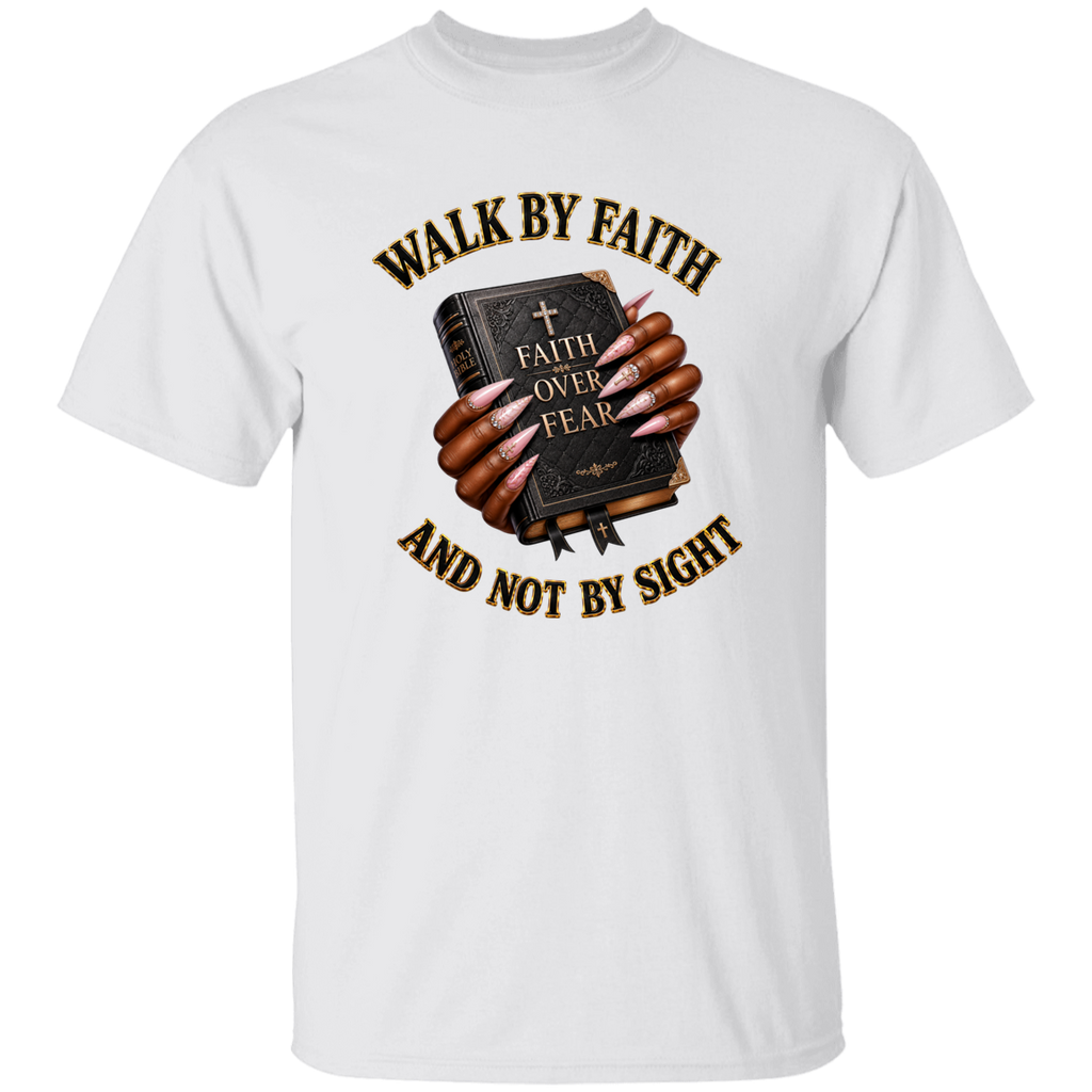 A white short-sleeve crewneck t-shirt featuring a graphic print of hands holding a dark Bible with the words 'FAITH OVER FEAR' and the text 'WALK BY FAITH AND NOT BY SIGHT' in brown and gold.