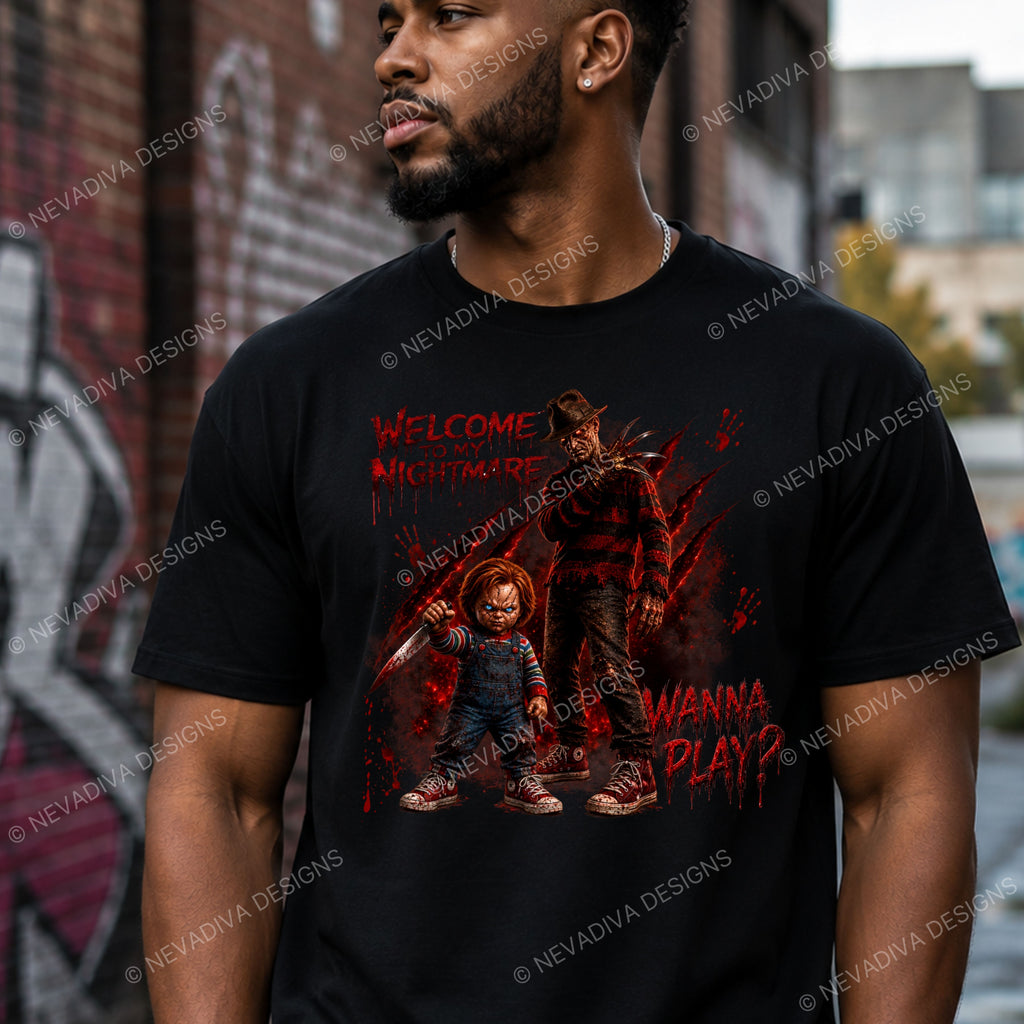 A man wearing a black graphic t-shirt featuring a horror-themed print of Freddy Krueger and Chucky with the text 'Welcome to Nightmare' and 'Wanna Play?'.