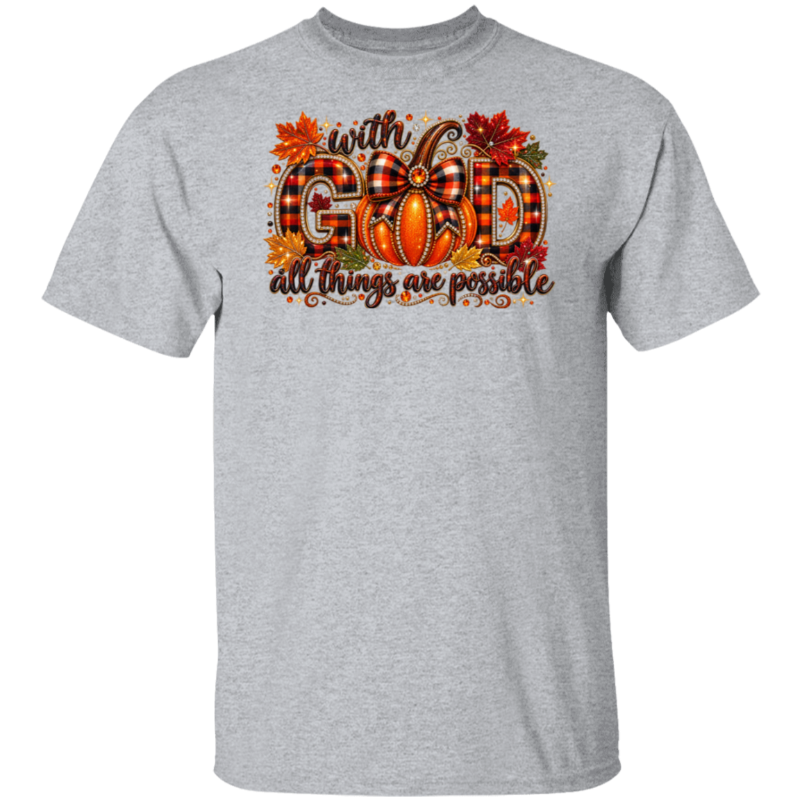 A heather gray short-sleeve crewneck t-shirt featuring a festive autumn graphic on the chest. The graphic displays the phrase 'with GOD all things are possible' in brown cursive and block lettering, decorated with a plaid bow, a pumpkin, and fall leaves.