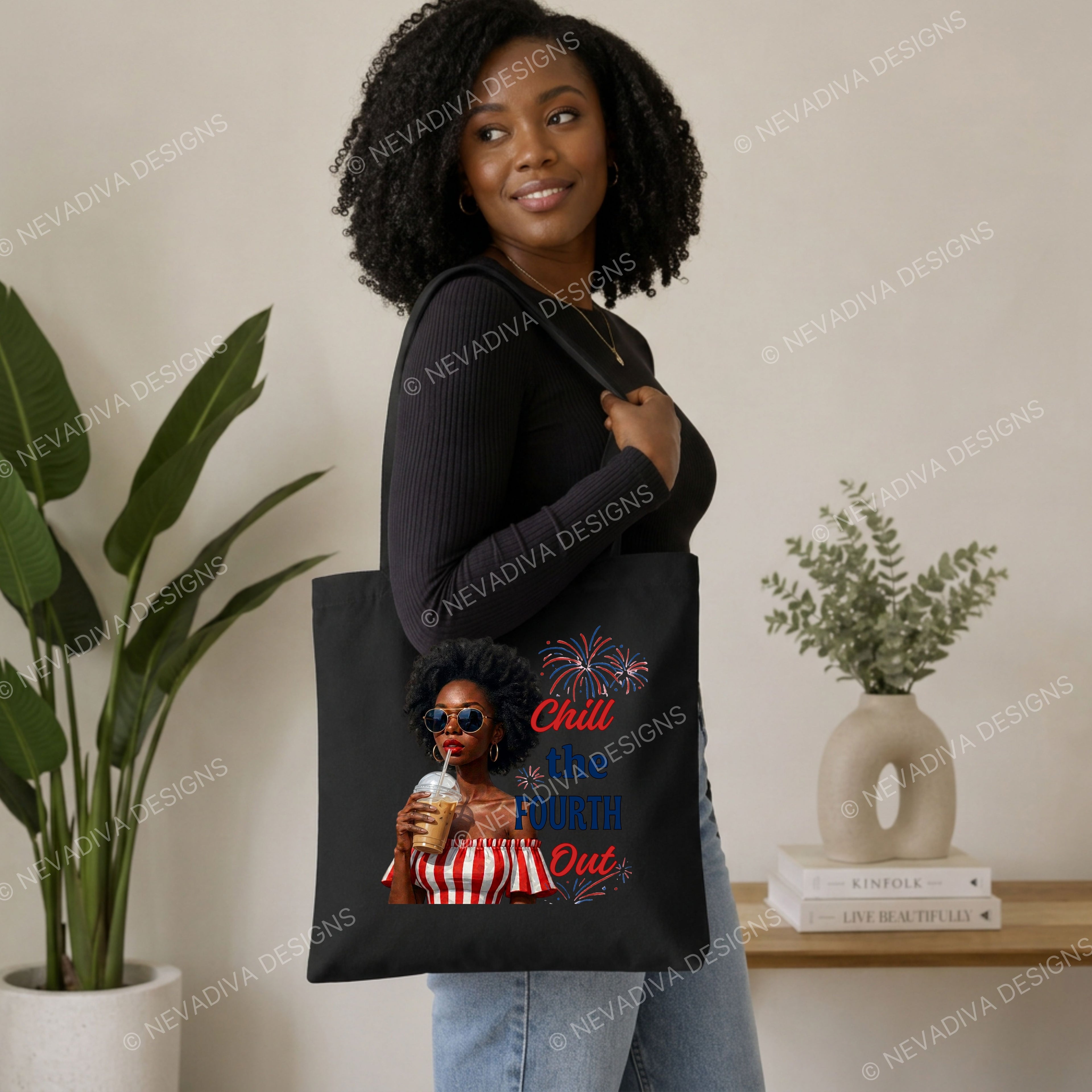 Woman holding a tote bag with a graphic design and text, standing in a room with plants and decor.
