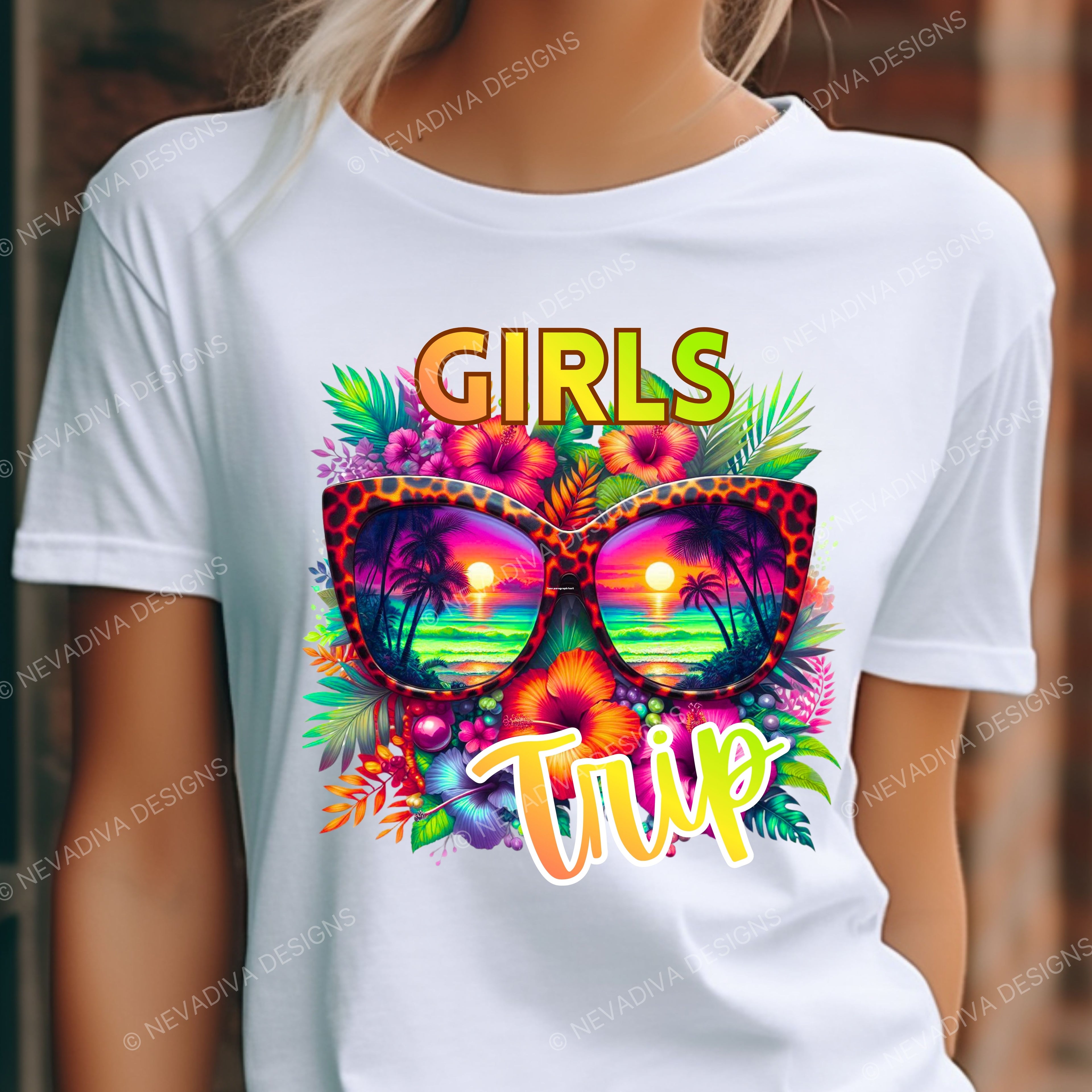 White t-shirt with colorful 'Girls Trip' design featuring sunglasses and tropical elements.