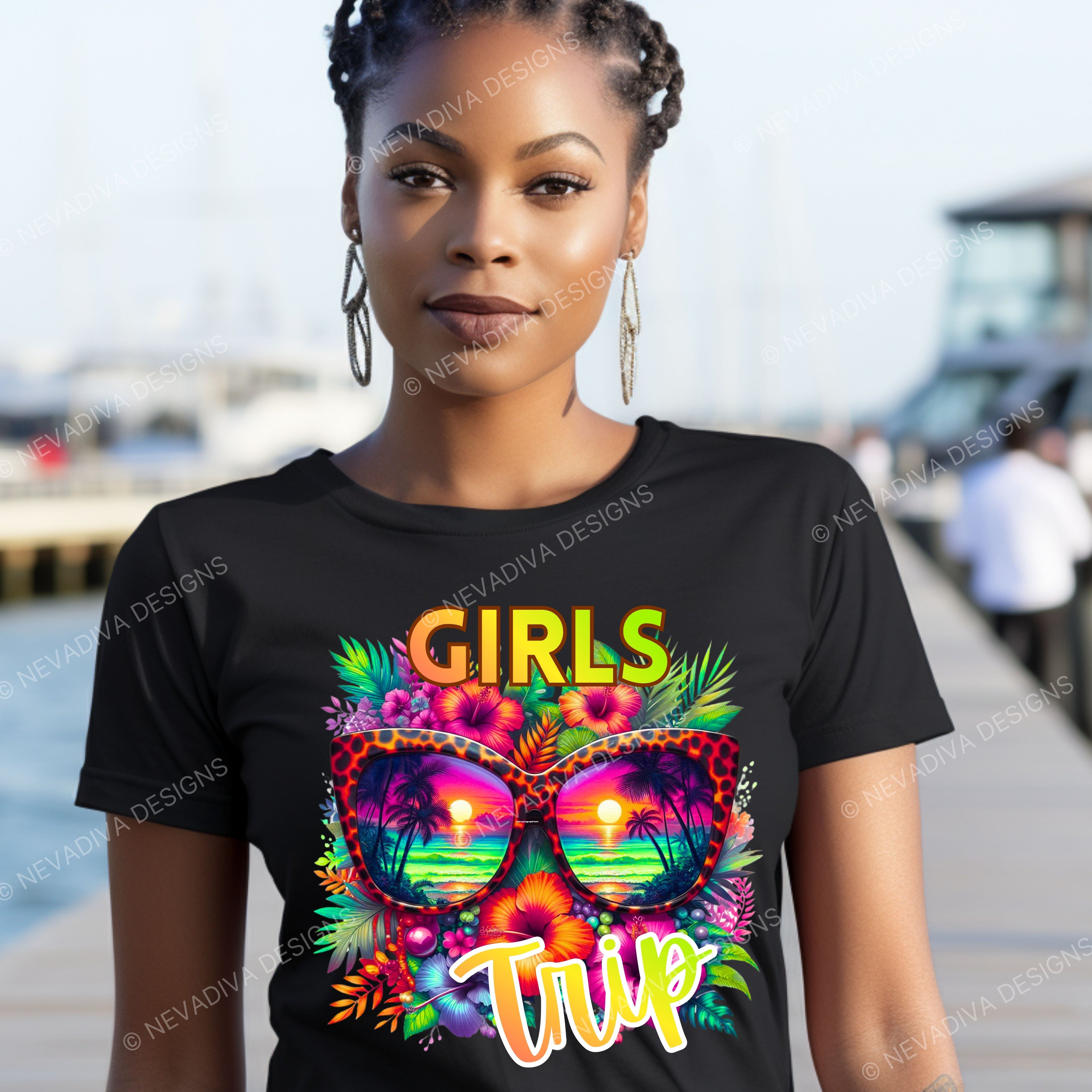 Woman wearing a black t-shirt with colorful sunglasses and 'Girls Trip' text by a waterfront.