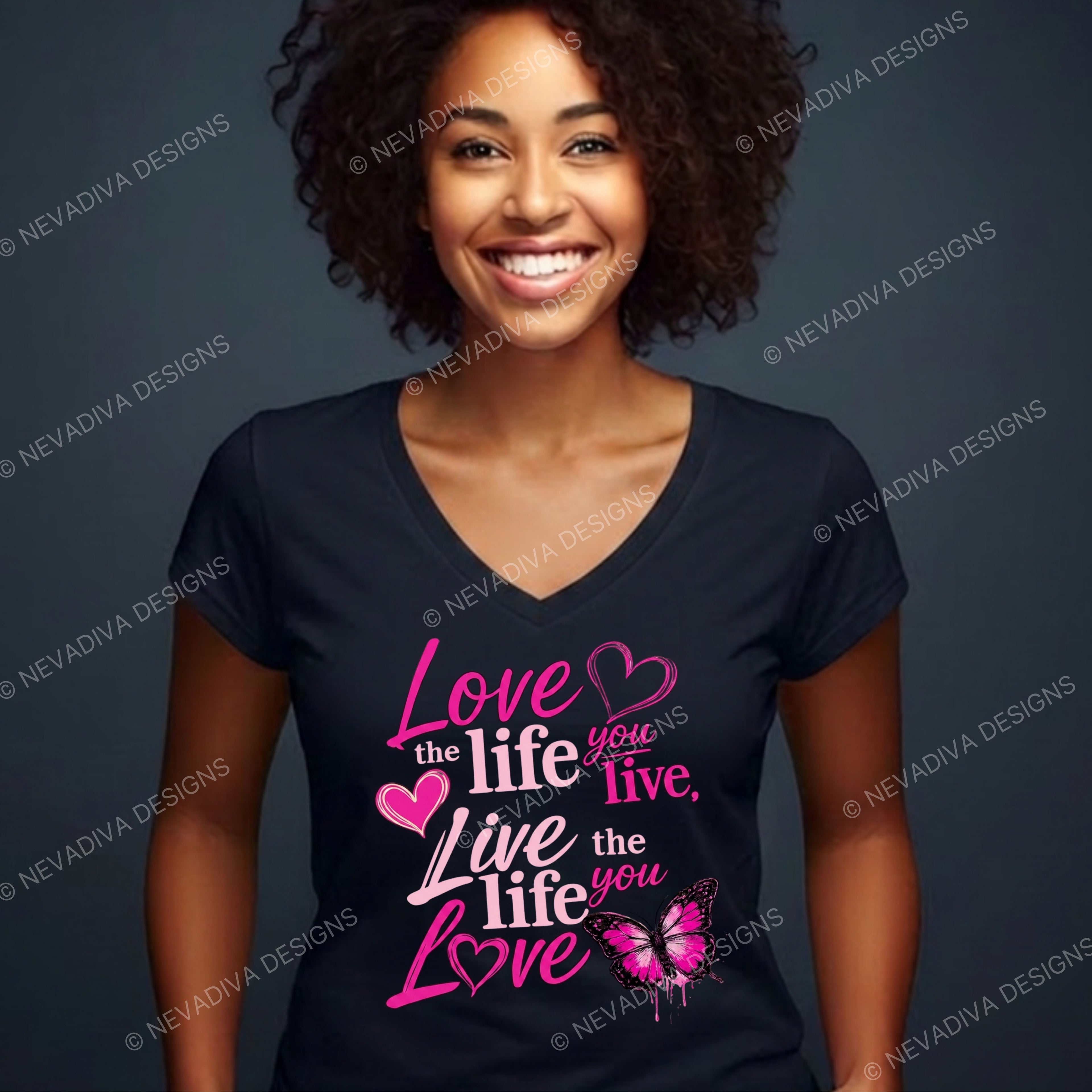Woman wearing a black t-shirt with pink motivational quote design on a dark background