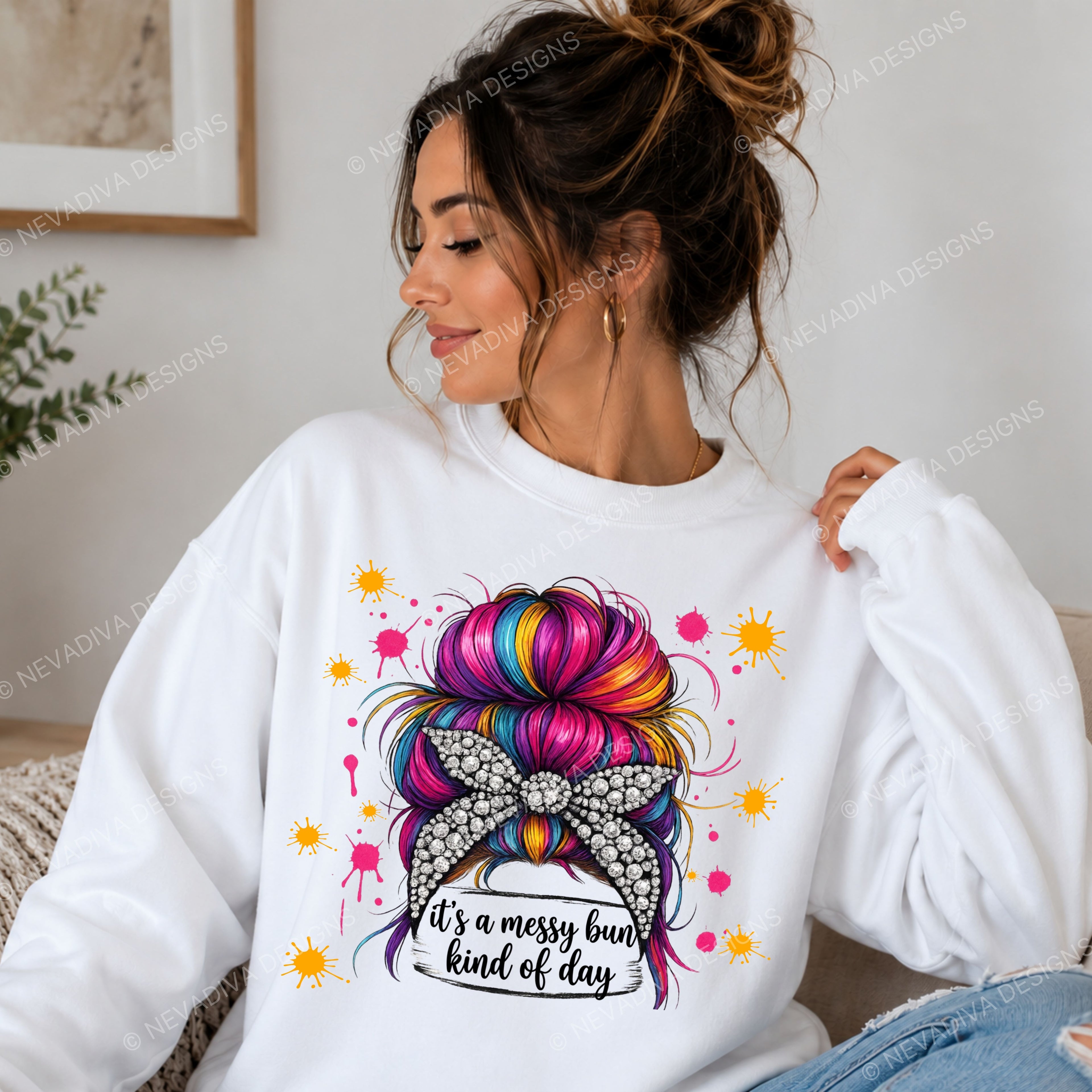 Woman wearing a white sweatshirt with a colorful bun design and text.