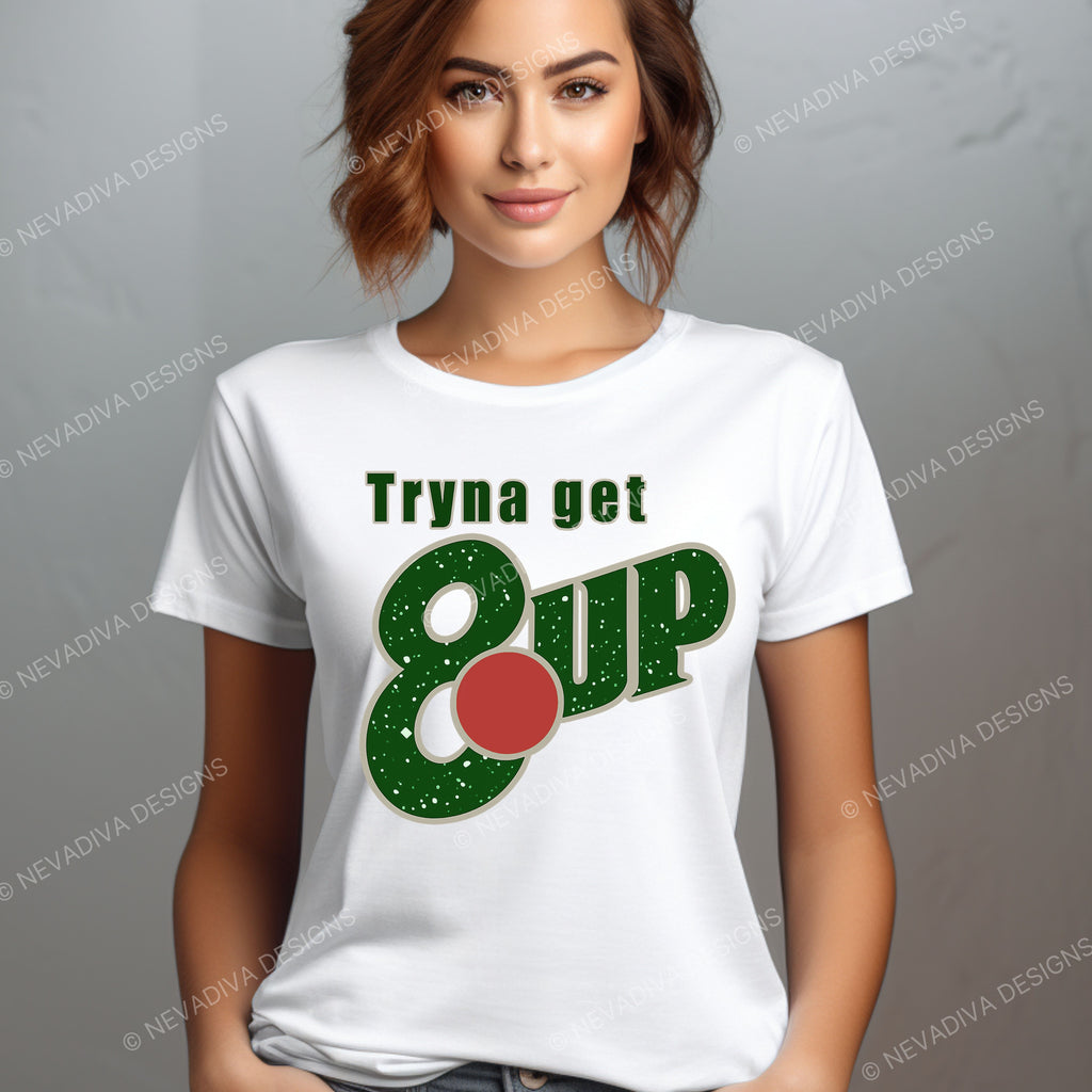 Woman wearing a white t-shirt with a humorous graphic design on a gray background